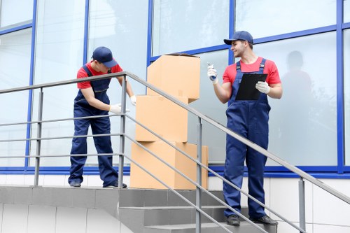 Professional movers handling household furniture in Hendon