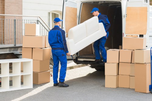 Local piano movers planning a route through a Hendon building