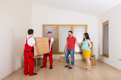 Moving boxes and furniture in a local Hendon property