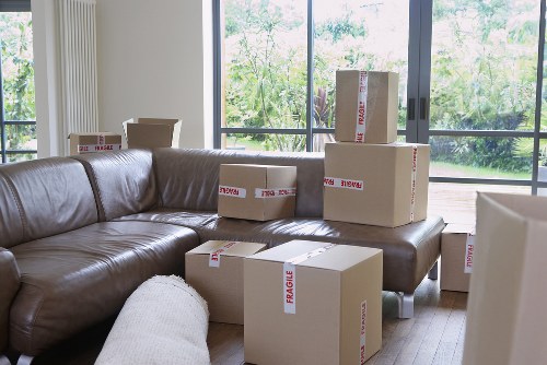 Packed moving boxes and furniture ready for flat removal